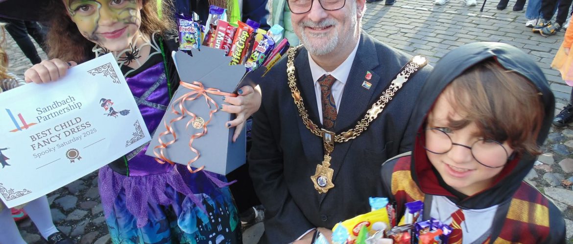 Mayor, Cllr John Arnold, presents prizes for best fancy dress at Spooky Saturday